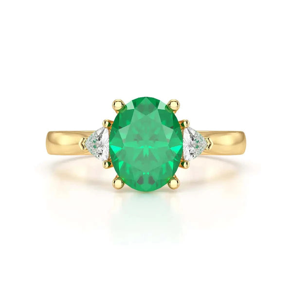 18ct Rose gold Emerald oval center with trillion shaped rings