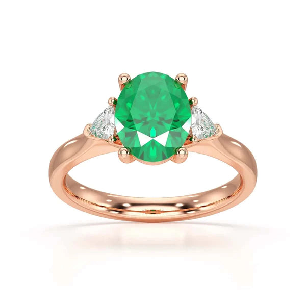 18ct Rose gold Emerald oval center with trillion shaped rings