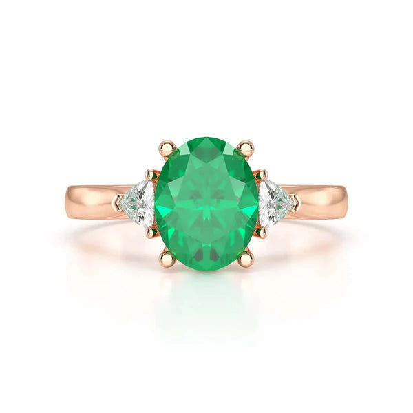 18ct Rose gold Emerald oval center with trillion shaped rings