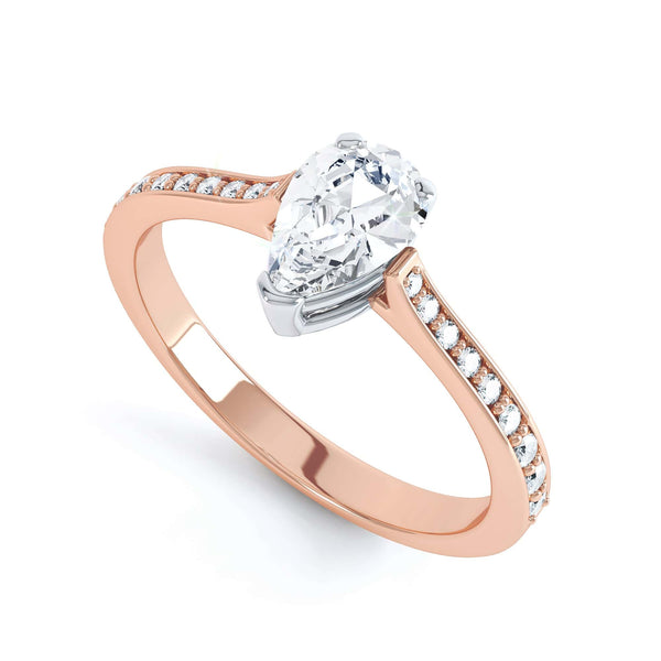 Diamond Engagement Ring with a Pear Shape diamond with shoulder set diamonds.