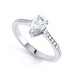 Diamond Engagement Ring with a Pear Shape diamond with shoulder set diamonds.