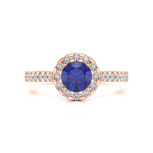 Elegant white gold ring in side profile, adorned with a central blue gemstone and small diamonds along the band, exuding sophistication and luxury.