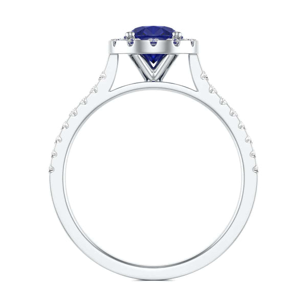 Elegant white gold ring in side profile, adorned with a central blue gemstone and small diamonds along the band, exuding sophistication and luxury.