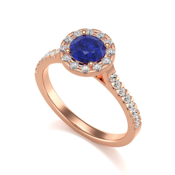 Elegant white gold ring in side profile, adorned with a central blue gemstone and small diamonds along the band, exuding sophistication and luxury.