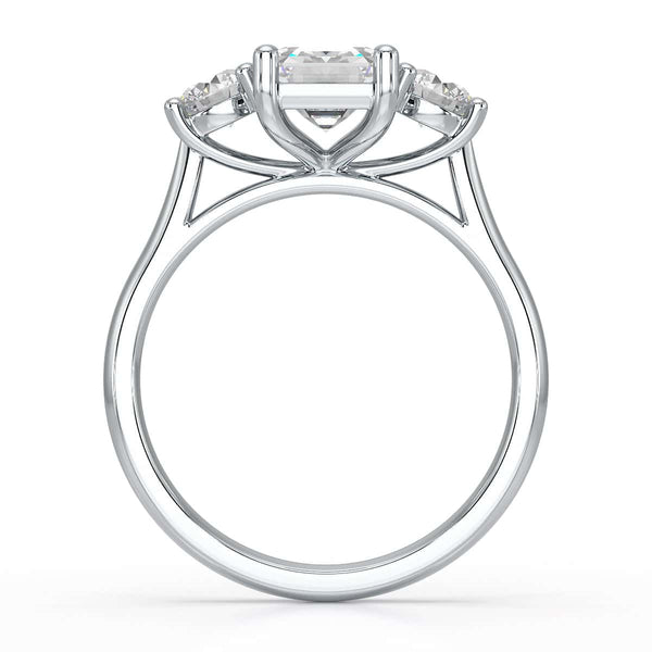 Emerald trilogy Engagement Ring with round side stone