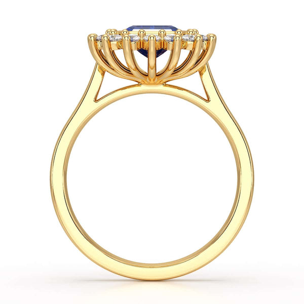 Elegant gold ring with a blue gemstone in a detailed crown setting, viewed from the side, highlighting its intricate design and luxury.