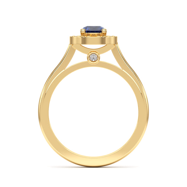 Hand wearing a ring with a blue gemstone