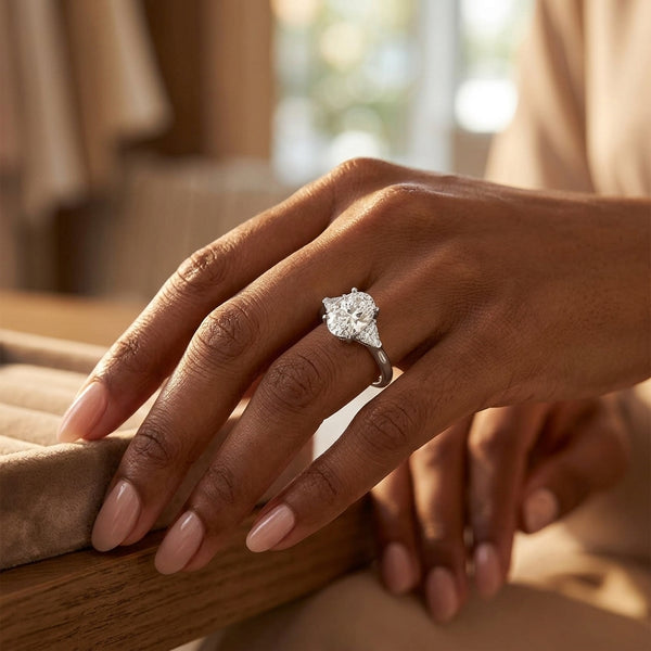 Oval Diamond Trilogy Engagement Ring with Trillion side stone