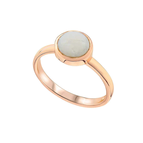 A minimalist white gold ring featuring a smooth round moonstone set in a sleek bezel setting, exuding elegance and simplicity against a plain background.