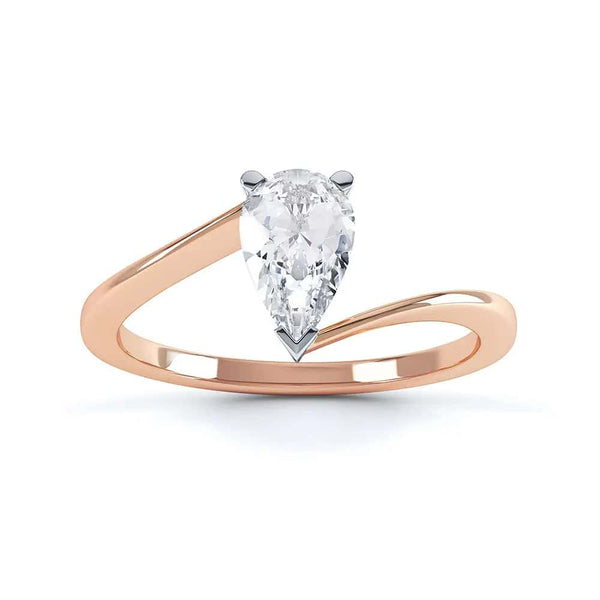 Solitaire Engagement Ring with Pear Shape Diamond with a twist Shank