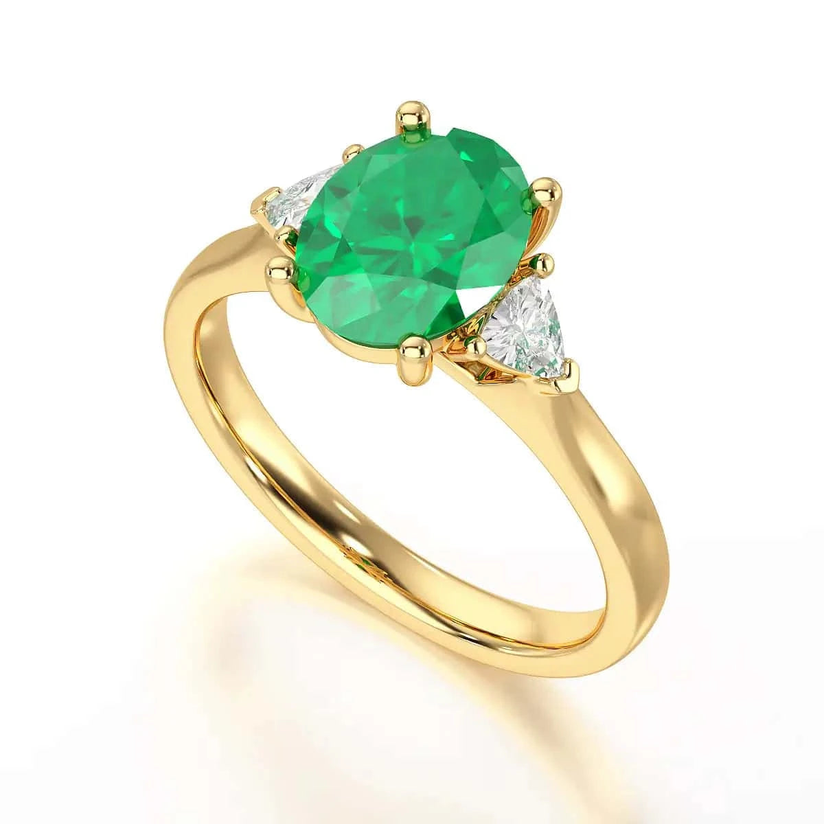 18ct Gold Emerald oval center with trillion shaped diamonds ring