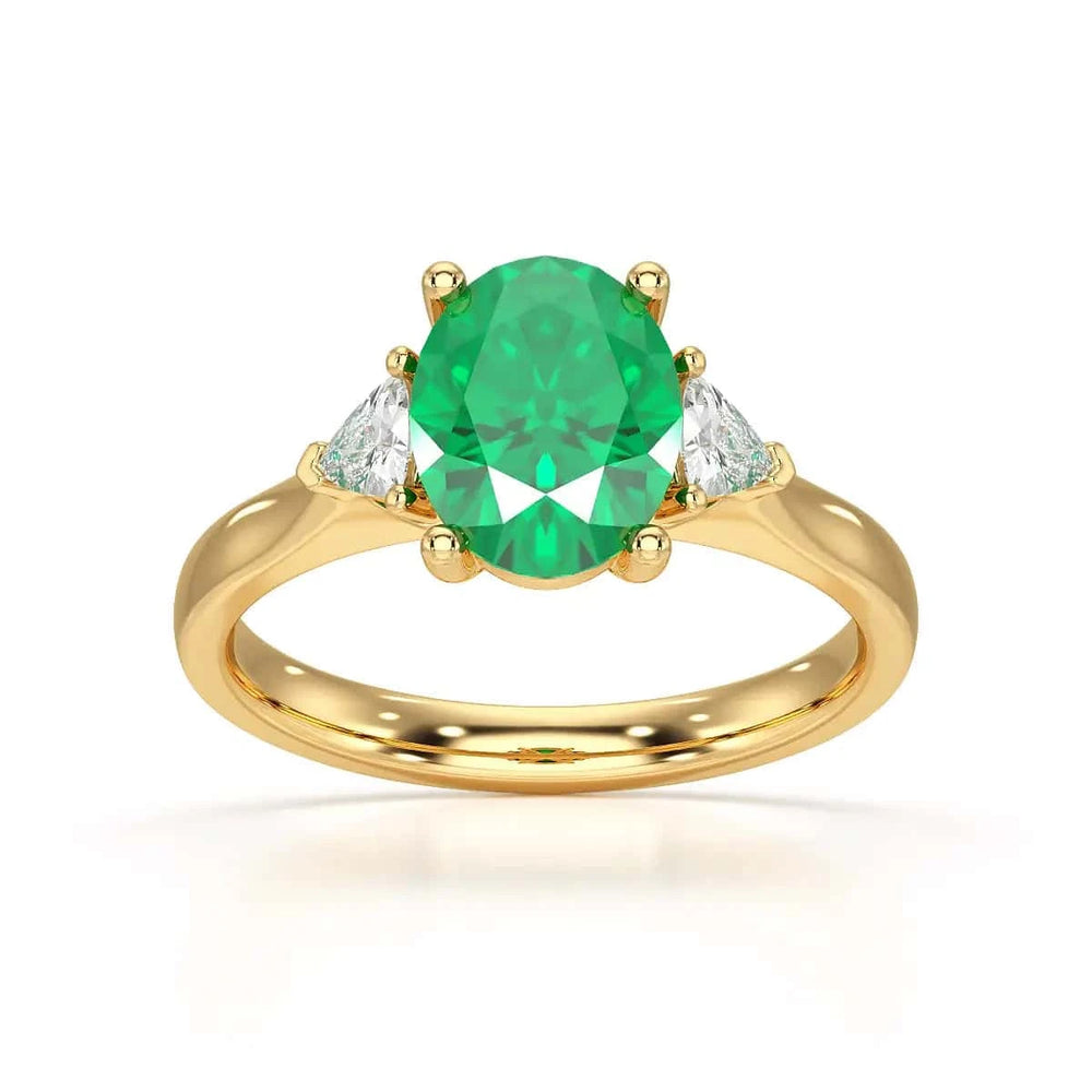 18ct Rose gold Emerald oval center with trillion shaped  rings