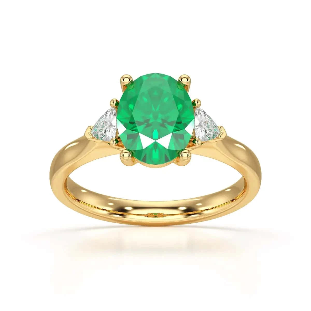 18ct Gold Emerald oval center with trillion shaped diamonds ring