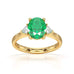 18ct Gold Emerald oval center with trillion shaped diamonds ring