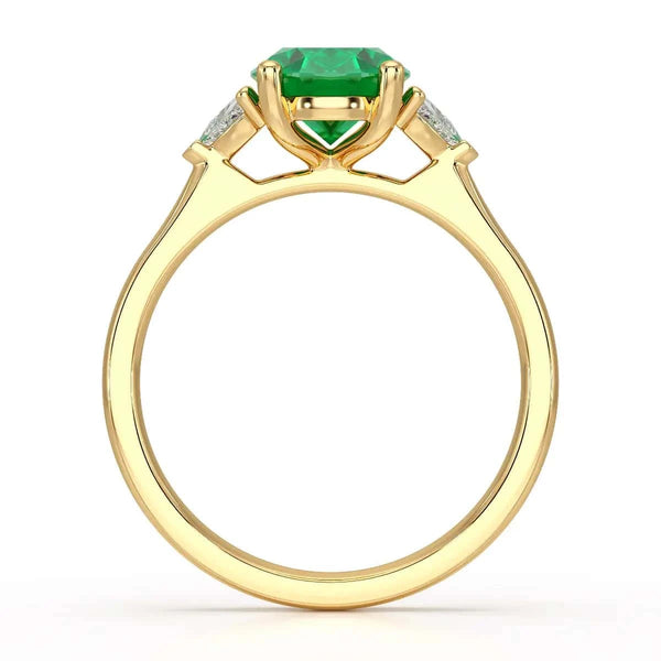 18ct Rose gold Emerald oval center with trillion shaped  rings