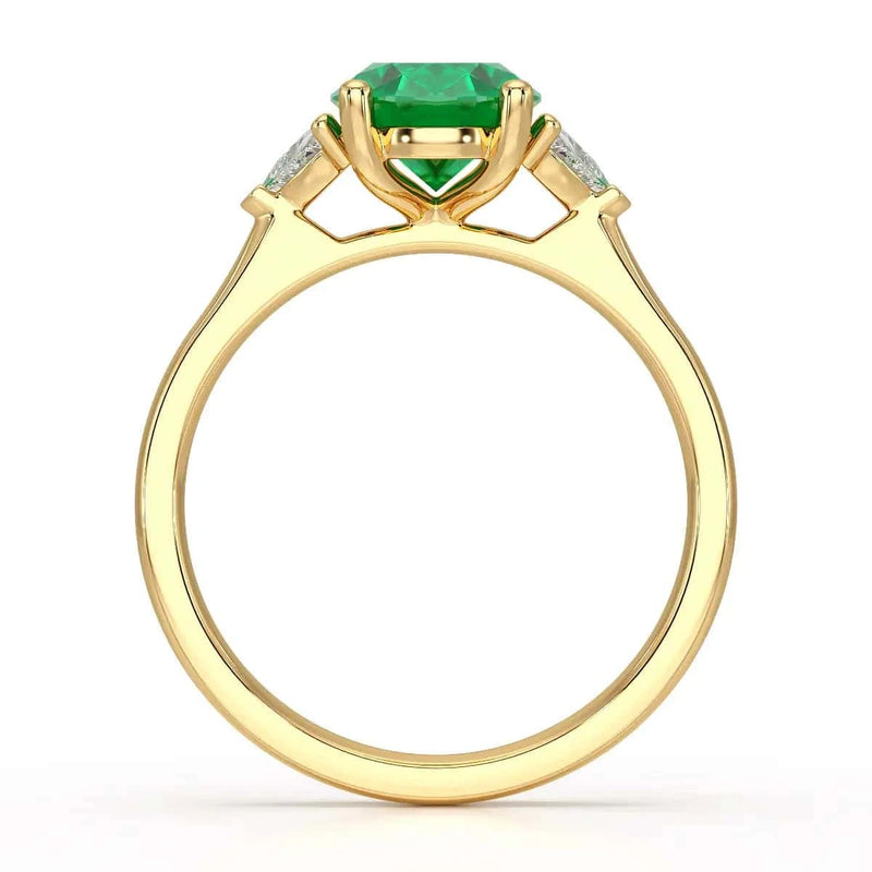 18ct Gold Emerald oval center with trillion shaped diamonds rings