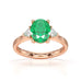 18ct Rose Gold Emerald oval center with trillion shaped diamonds ring