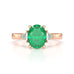 18ct Rose gold Emerald oval center with trillion shaped diamonds Engagement rings