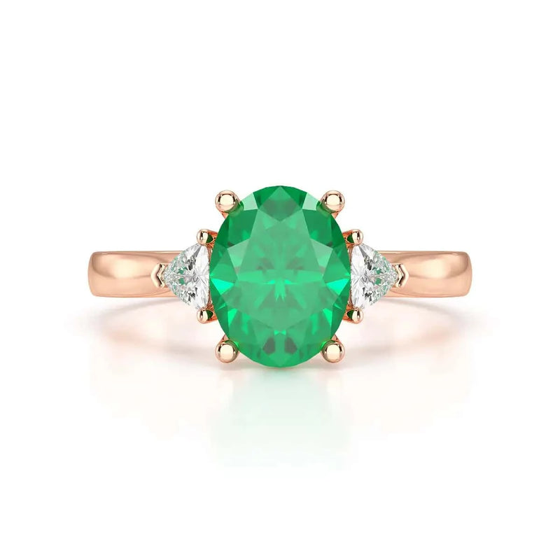18ct Rose gold Emerald oval center with trillion shaped diamonds Engagement rings