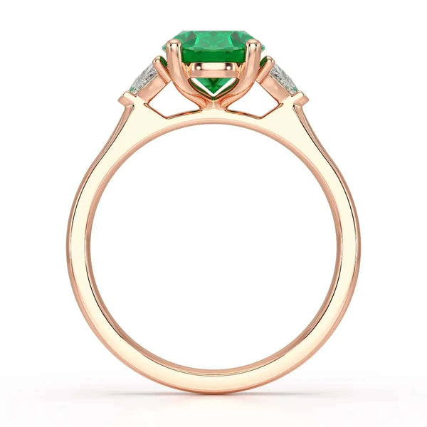 18ct Rose gold Emerald oval center with trillion shaped  rings