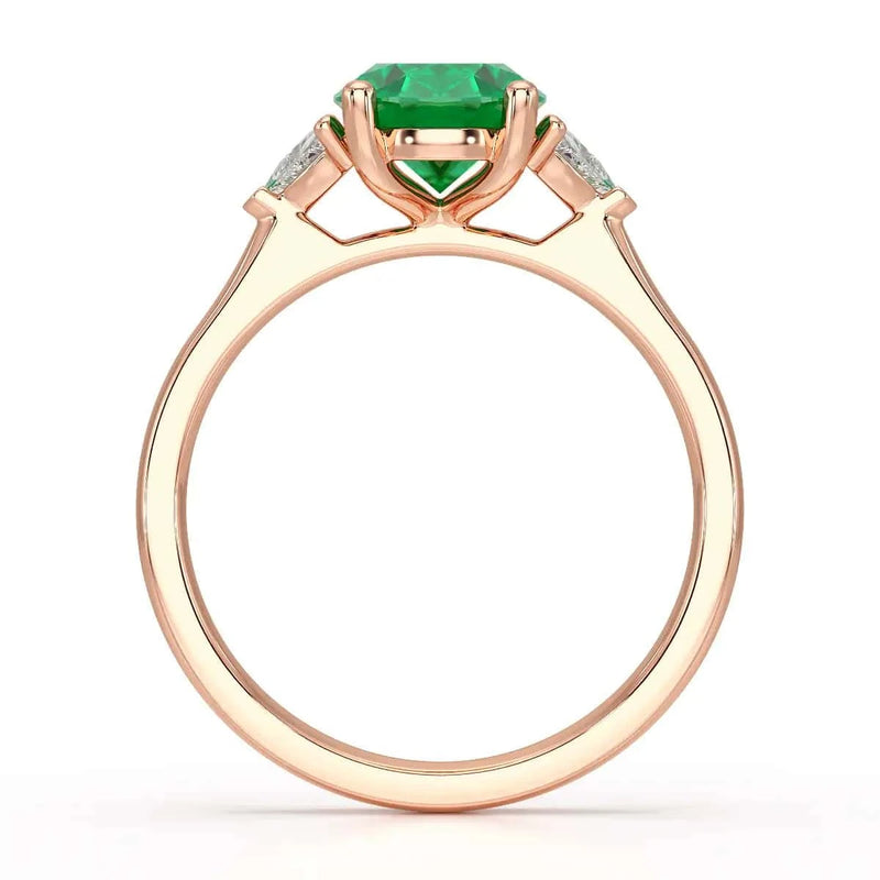 18ct Rose gold Emerald oval center with trillion shaped  rings