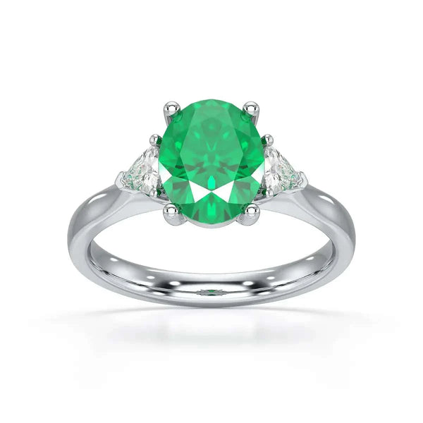 18ct Rose gold Emerald oval center with trillion shaped  rings