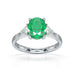 18ct White Gold Emerald oval center with trillion shaped diamonds ring