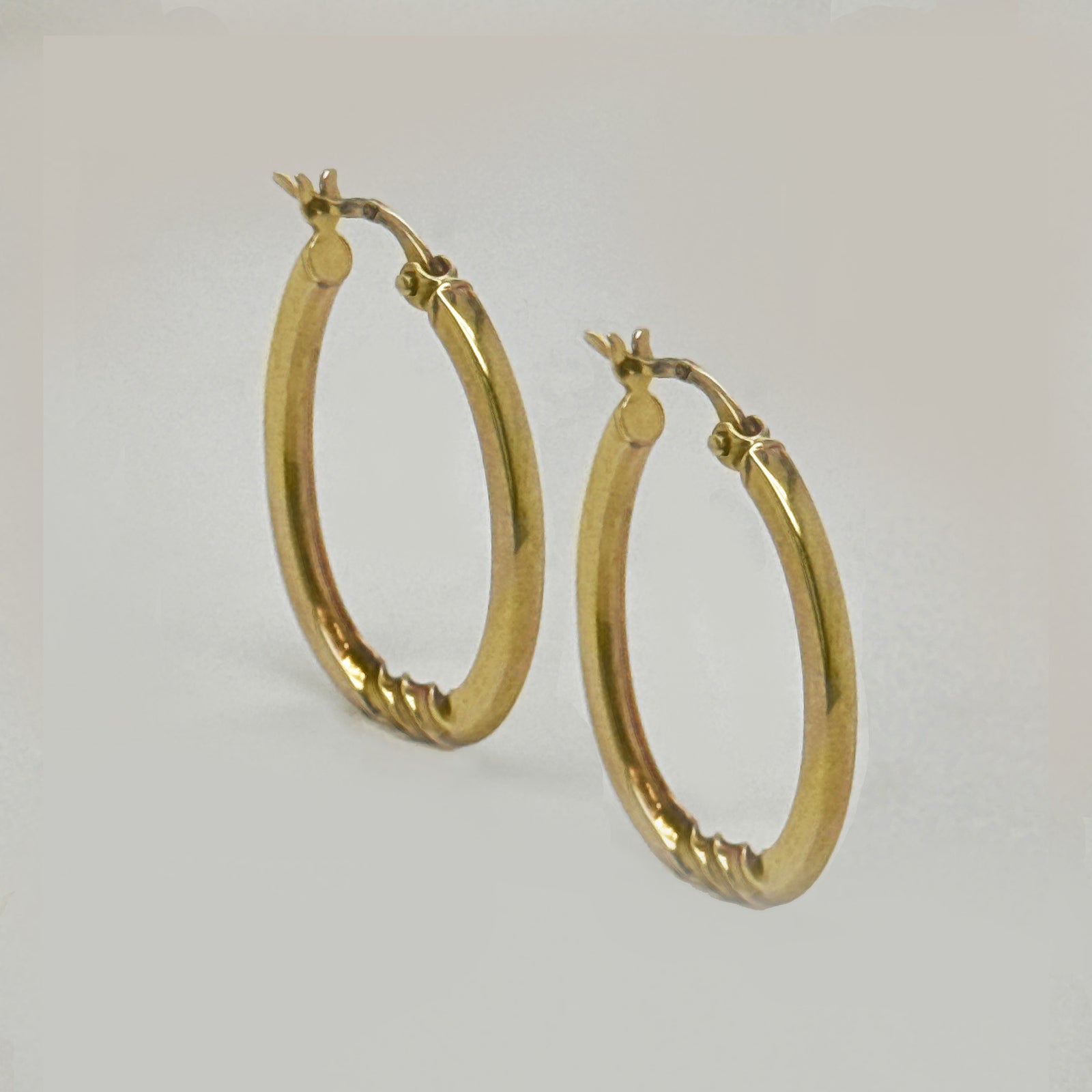 9K Yellow Gold Oval Twisted Accent Hoop Earrings