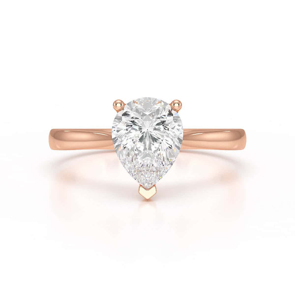 Diamond Solitaire Engagement Ring With a Pear Shape Diamond Solitaire and Tapered Shoulders