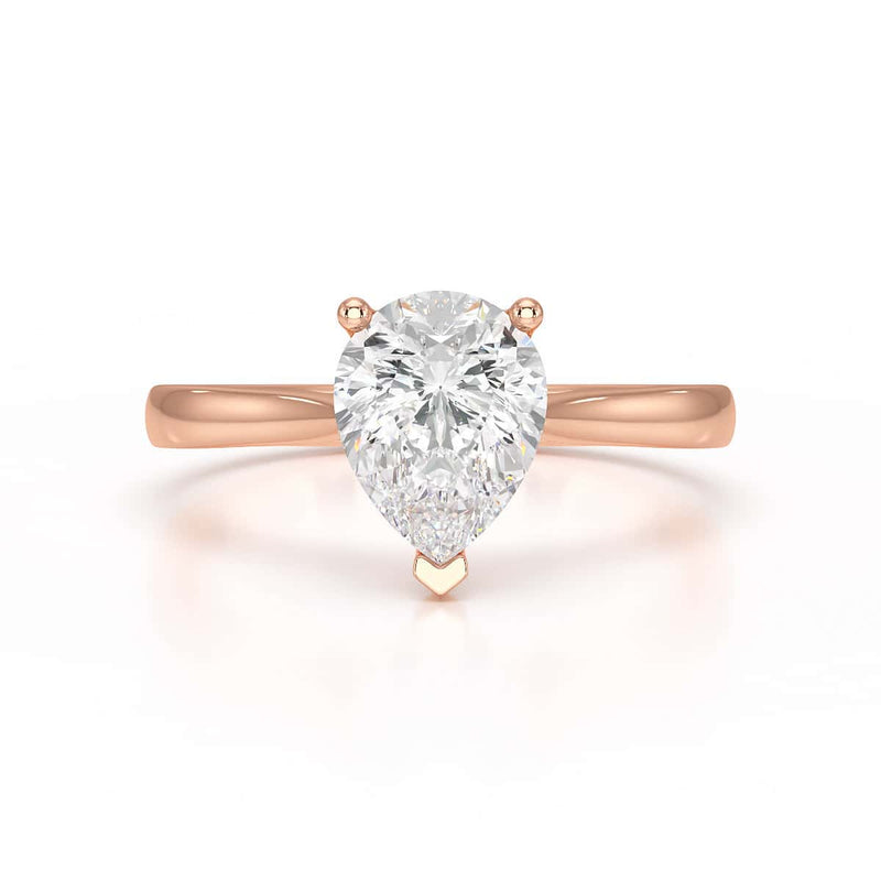 Diamond Solitaire Engagement Ring With a Pear Shape Diamond Solitaire and Tapered Shoulders