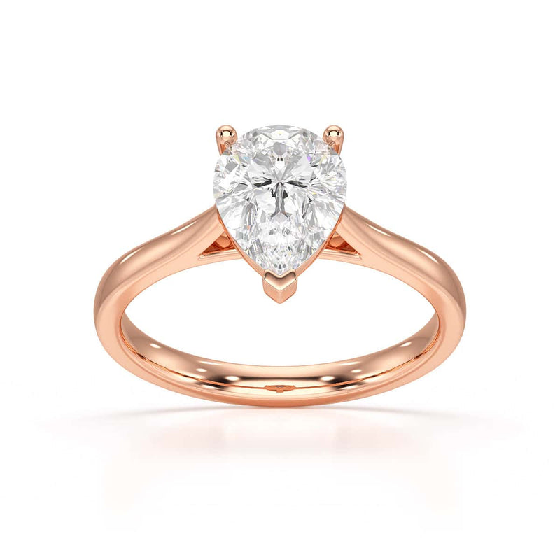Diamond Solitaire Engagement Ring With a Pear Shape Diamond Solitaire and Tapered Shoulders