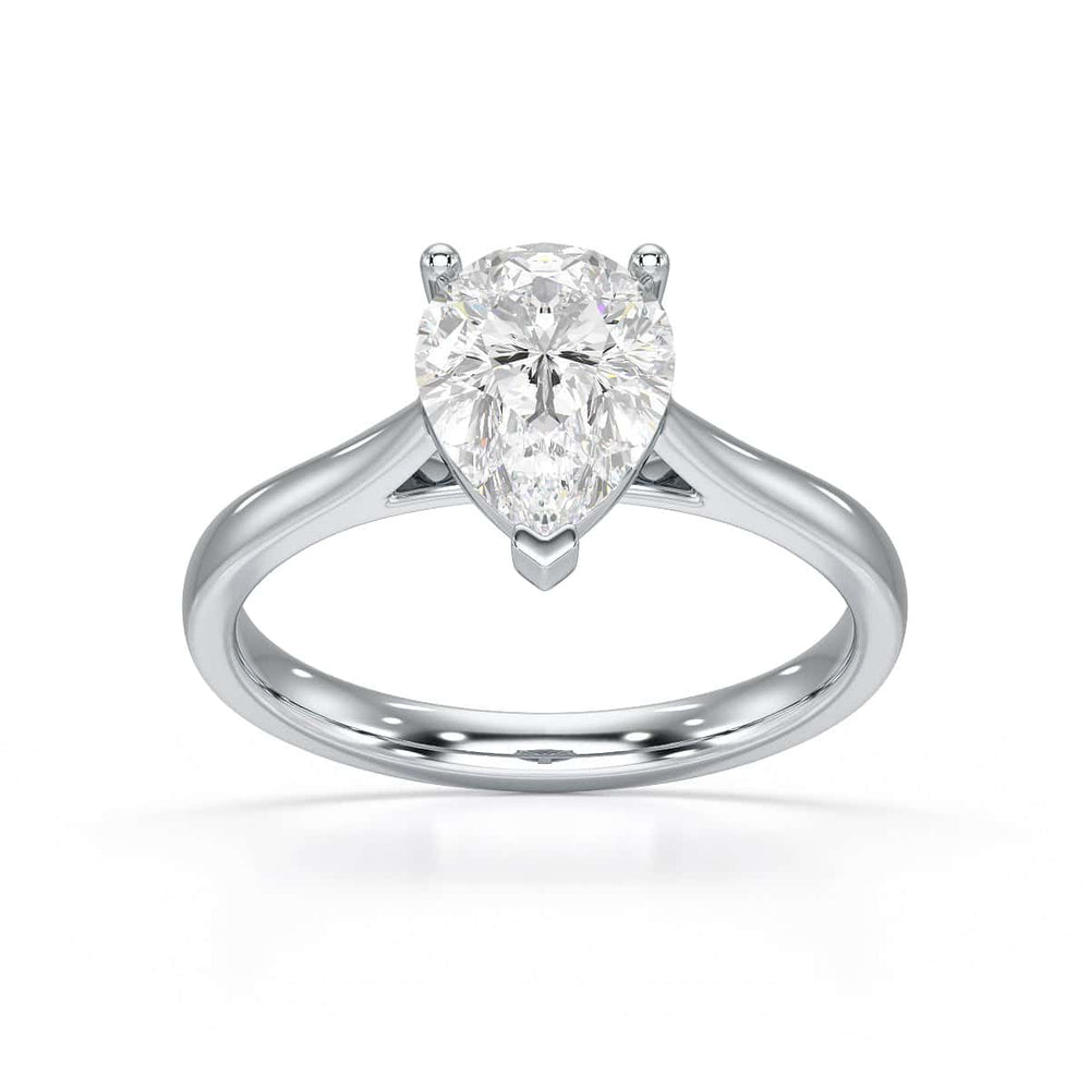 Diamond Solitaire Engagement Ring With a Pear Shape Diamond Solitaire and Tapered Shoulders
