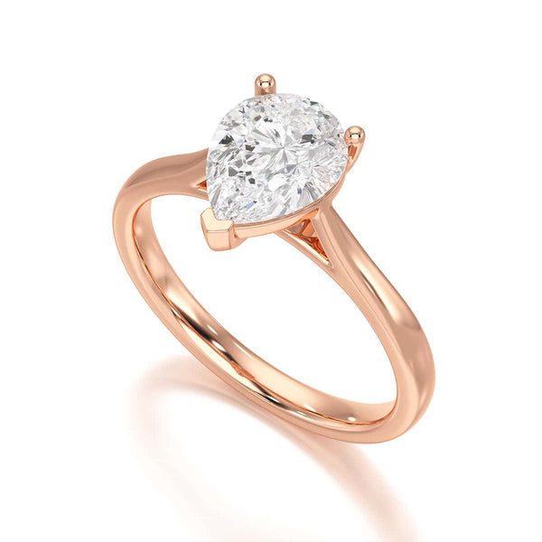 Diamond Solitaire Engagement Ring With a Pear Shape Diamond Solitaire and Tapered Shoulders