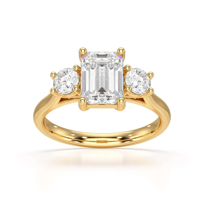 Emerald trilogy Engagement Ring with round side stone