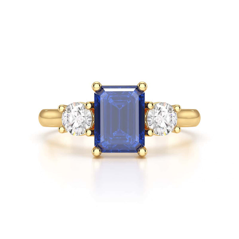 Sapphire trilogy with round side stone Dress ring