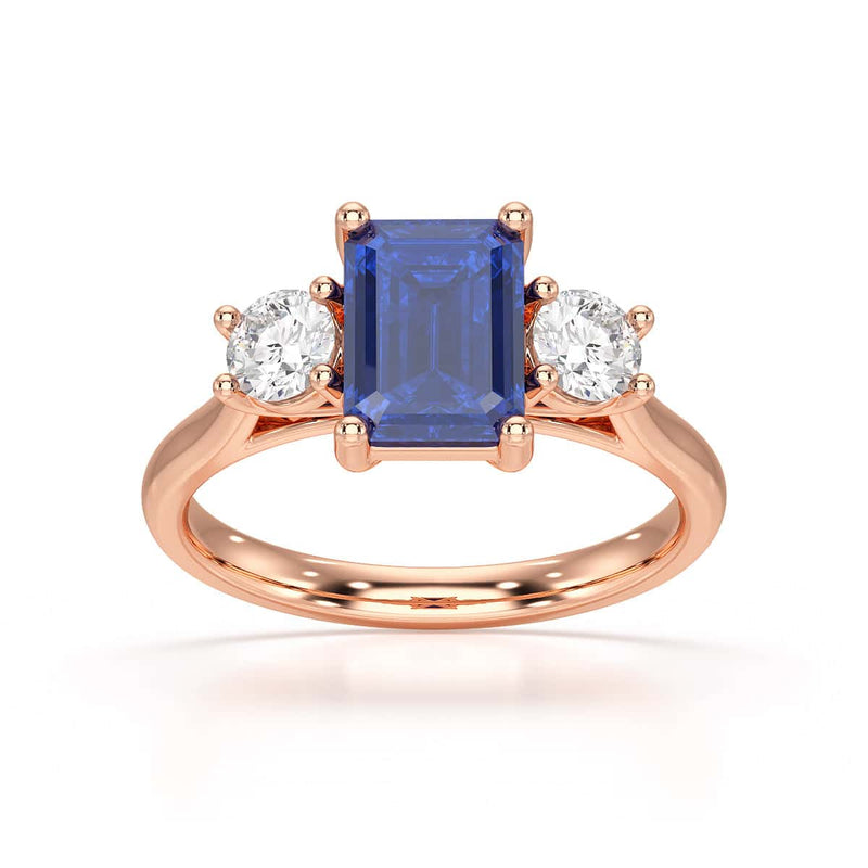 Sapphire trilogy with round side stone Dress ring
