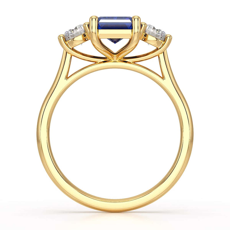 Sapphire trilogy with round side stone Dress ring
