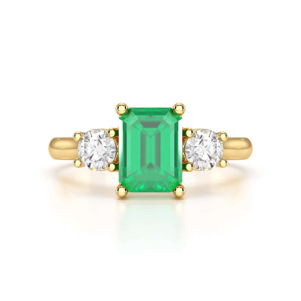 Emerald trilogy with round side stone Dress ring
