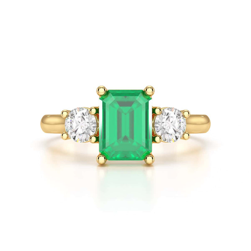 Emerald trilogy with round side stone Dress ring