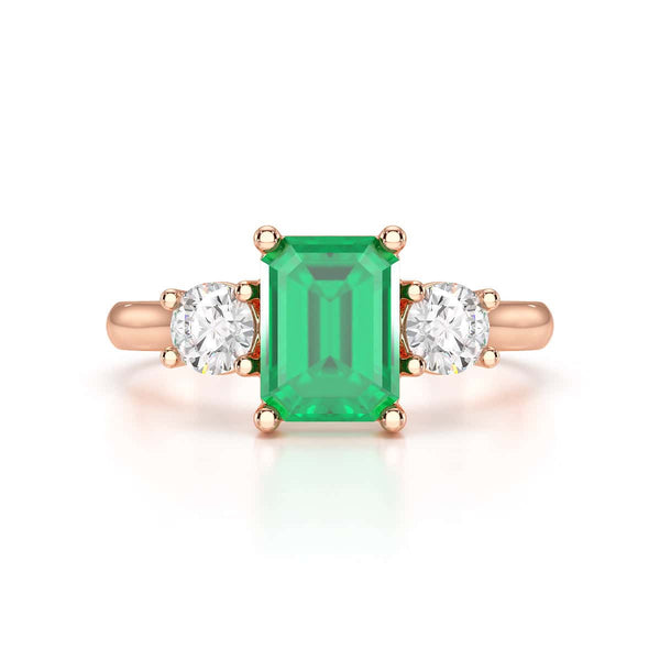 Emerald trilogy with round side stone Dress ring