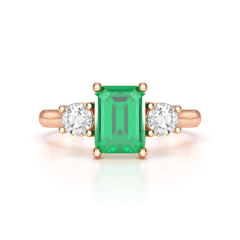 Emerald trilogy with round side stone Dress ring