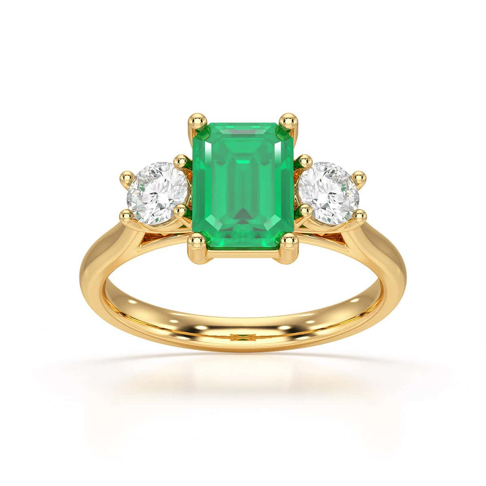 Emerald trilogy with round side stone Dress ring