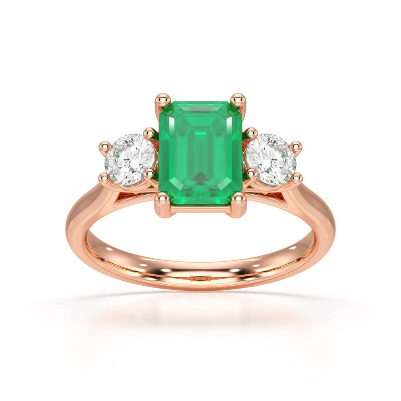 Emerald trilogy with round side stone Dress ring