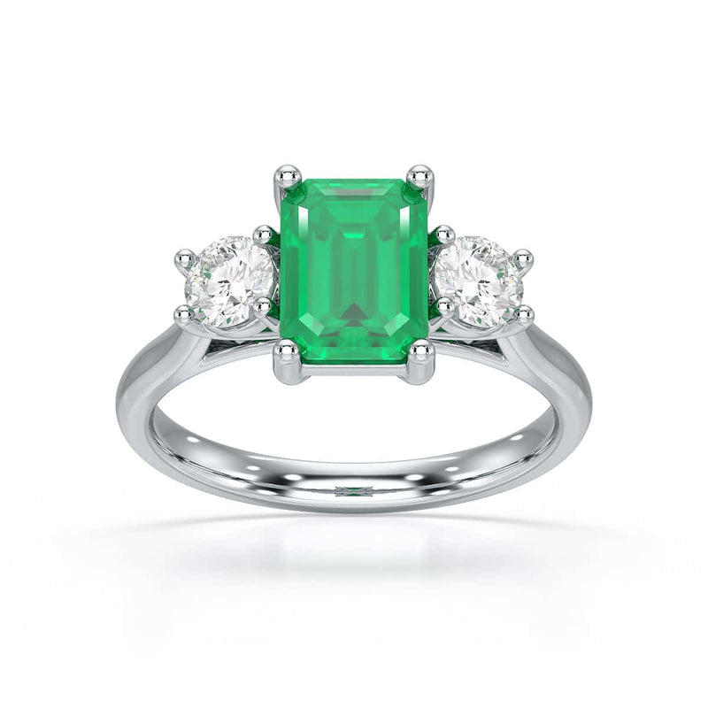 Emerald trilogy with round side stone Dress ring