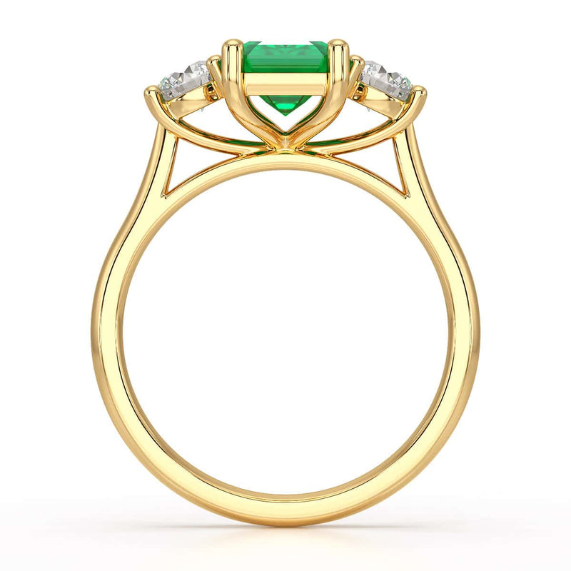 Emerald trilogy with round side stone Dress ring
