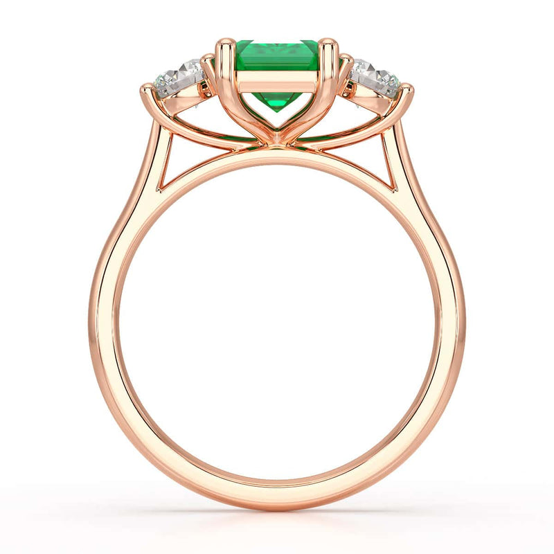 Emerald trilogy with round side stone Dress ring