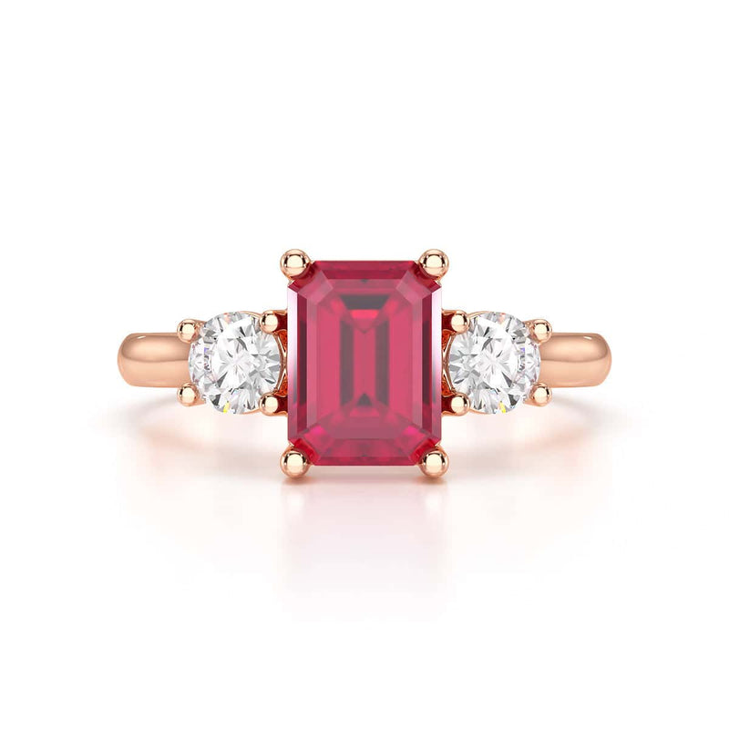 Ruby trilogy with round side stone Dress ring