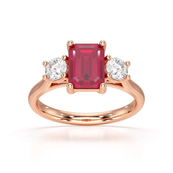 Ruby trilogy with round side stone Dress ring