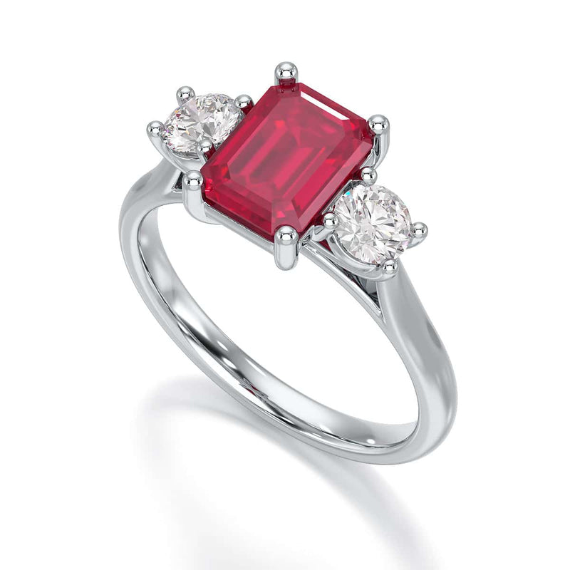 Ruby trilogy with round side stone Dress ring