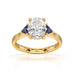 Oval trilogy engagement ring with trillion shaped blue sapphire side stones
